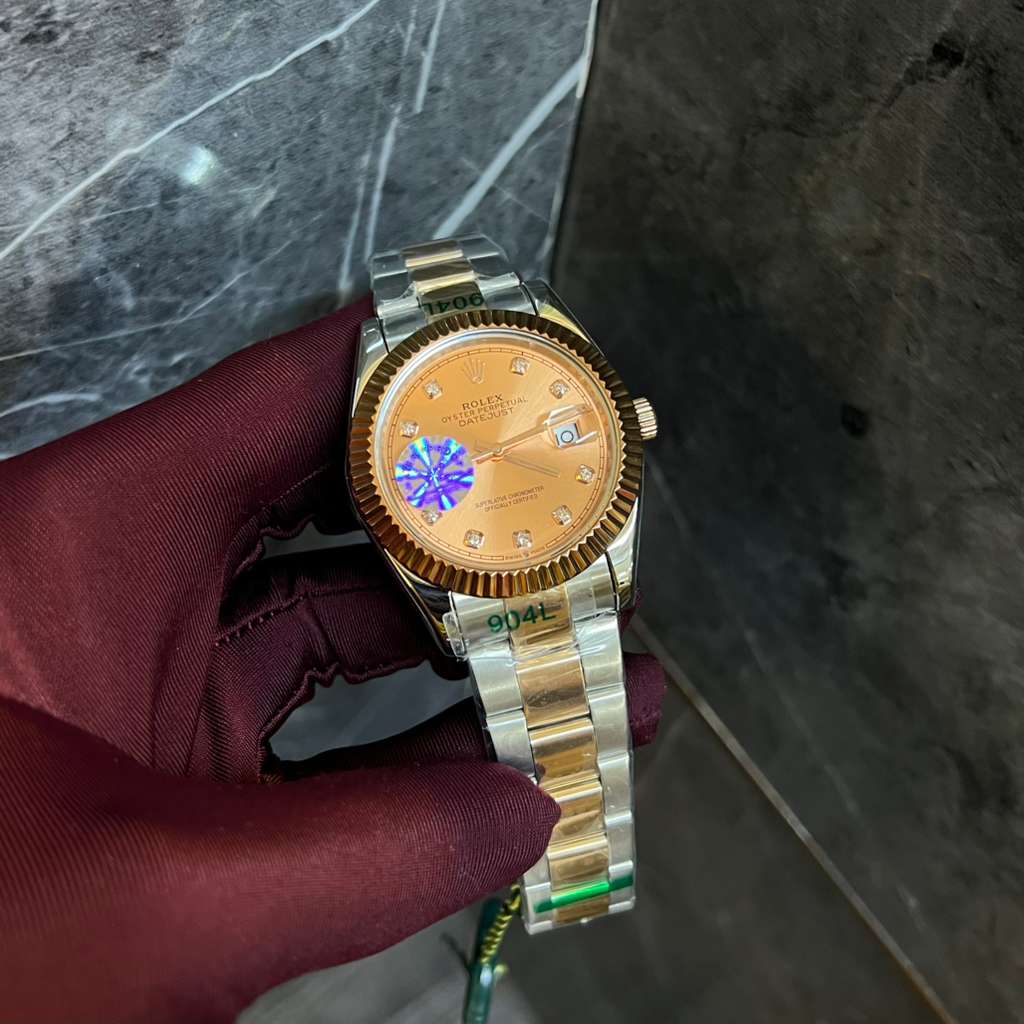 Rolex Datejust Watch with a Gold Colored Dial and a Two Tone Metal Bracelet